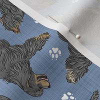 Trotting black tailed Cocker Spaniels and paw prints - faux denim