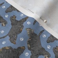 Tiny Trotting black tailed Cocker Spaniels and paw prints - faux denim