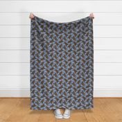 Trotting chocolate tailed Cocker Spaniels and paw prints - faux denim