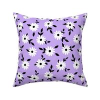 White daisy flowers with black leaves and purple lilac background (small size version)