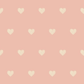 Scribbled hearts in cream on salmon pink