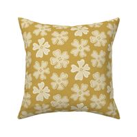 button flowers on satin sheen gold