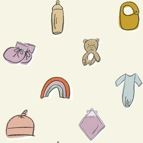 Cute Newborn Baby Nursery Items on Cream - Booties, Rainbow, Bib, Blanket, Bottle, Teddy Bear