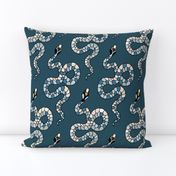 white and gray snakes on dark cerulean blue