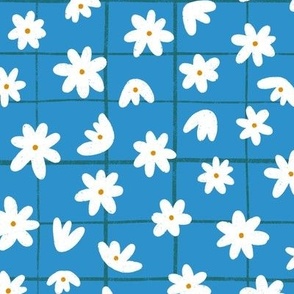 White flowers on blue checked pattern