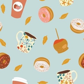 Fall donuts, coffee, treats and goodies on light blue