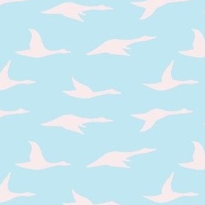 Pale pink swan silhouette on light blue