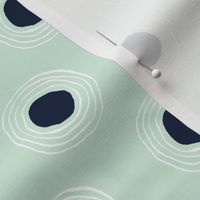 Filled ripples in navy and white on mint green