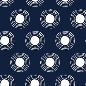 white ripple circles filled on navy blue