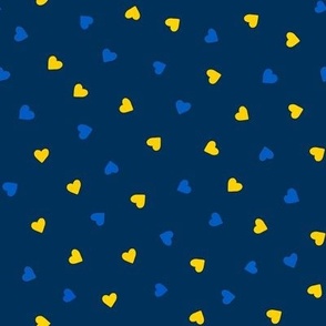 Small hearts in Ukrainian flag colours on dark blue 