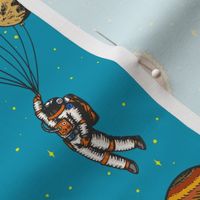 Astronaut with Planet Ballons On Blue