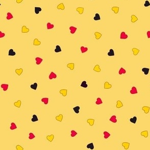 Small hearts in German / Belgian flag colours on yellow 