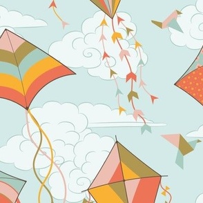 Large // colorful kites flying in blue sky with clouds