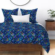 Circles in circles on tiles patchwork cheater quilt in rich velvety blues and multi patterned