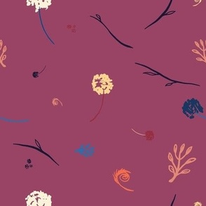 Silhouettes of flowers and leaves on garnet