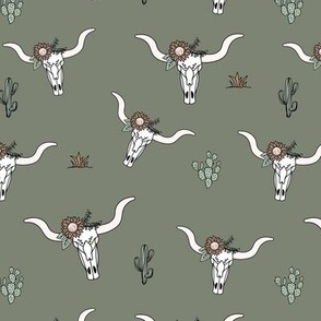 Ranch life with longhorn cows skull flowers and cacti western desert theme on cameo green