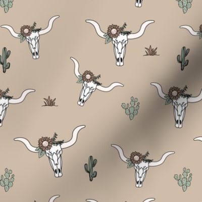 Ranch life with longhorn cows skull boho flowers and cacti western desert theme on tan beige