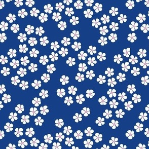 Little white scandinavian minimalist ditsy flower on eclectic blue