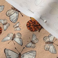 Dark academia tossed butterflies white, orange and beige on desert sand watercolour paper textured background