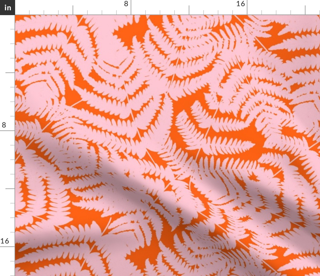 Pink fern on orange background