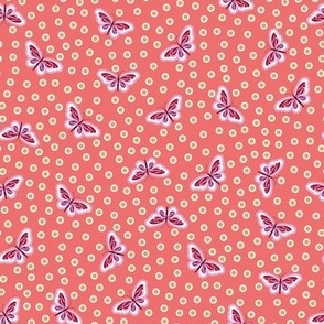 Delightful spring scene of cute butterflies scattered all over on salmon pink polka dot pattern - mid size