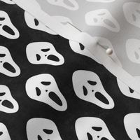 Small Scale White Halloween Scream Face Masks on Black