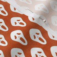 Small Scale White Halloween Scream Face Masks on Orange