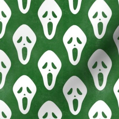 Medium Scale White Halloween Scream Face Masks on Green