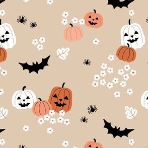 Happy halloween pumpkins bats and spiders with boho blossom vintage daisies white orange on tan