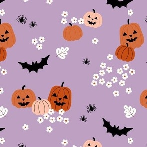 Happy halloween pumpkins bats and spiders with boho blossom vintage daisies orange blush on bright nineties lilac purple