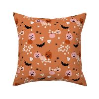 Happy halloween pumpkins bats and spiders with boho blossom vintage daisies orange blush on papaya