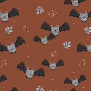 Adorable baby bats for autumn halloween design freehand drawn gray on rust brown