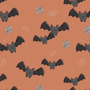 Adorable baby bats for autumn halloween design freehand drawn gray rust on sienna burnt orange
