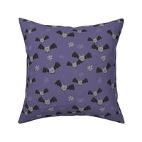 Adorable baby bats for autumn halloween design freehand drawn gray rust on purple