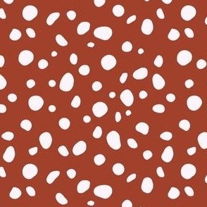 Cheetah spots on red background