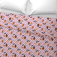 Halloween pumpkins and witches hats bats and spiders on classic checkerboard lilac blush orange peach