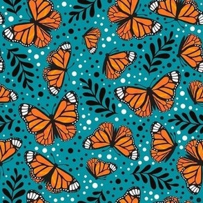Medium Scale Orange Monarch Butterflies on Lagoon Blue