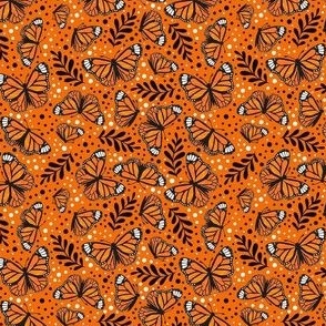 Small Scale Orange Monarch Butterflies on Carrot Orange