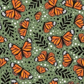 Medium Scale Orange Monarch Butterflies on Moss Green