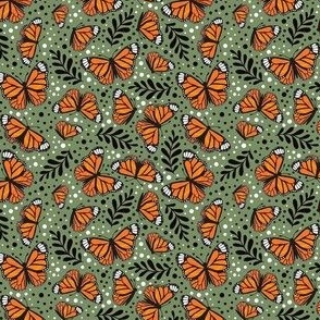 Small Scale Orange Monarch Butterflies on Moss Green