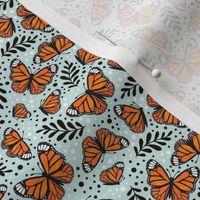 Small Scale Orange Monarch Butterflies on Pale Seaglass Aqua