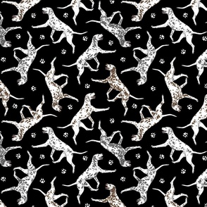 Trotting Dalmatians and paw prints - black