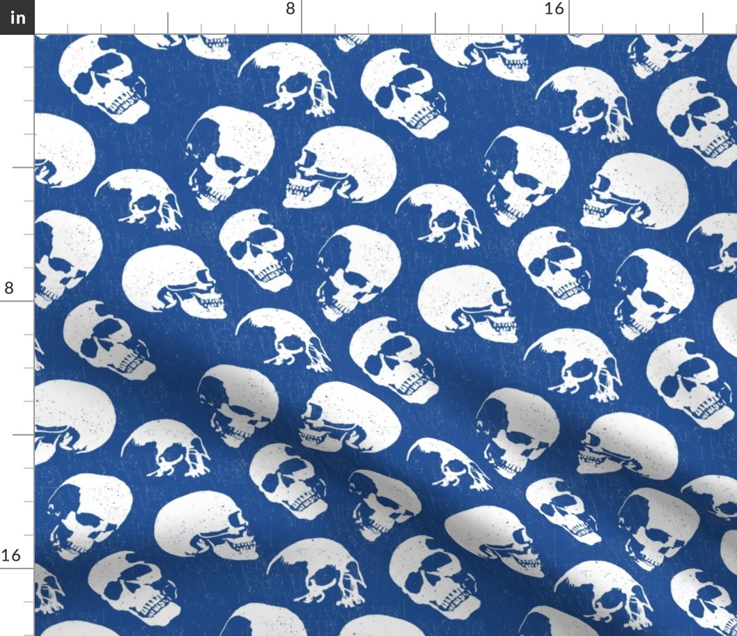 Spooky Skulls, White on Blue by Brittanylane