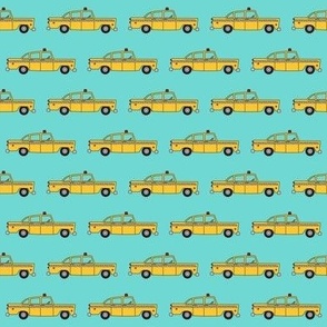 tiny taxis on teal