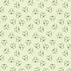 Shamrock Clover in Irish Green Outlines Scattered on a Light Celery Green Background