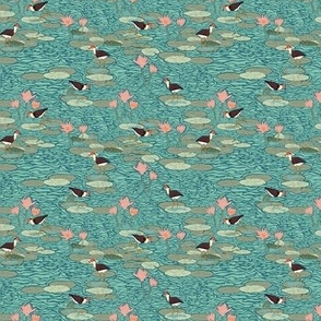 Mini Jacana Lily Trotter Birds walking in a Water Lily Pond with a Whaling Waters Teal Blue Background