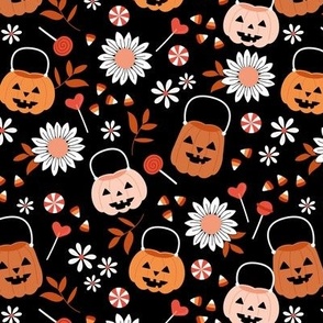 Smiley pumpkin buckets and sunflowers trick or treat fright night halloween kids design with candy corn and lollipops pink blush orange seventies vintage palette on black