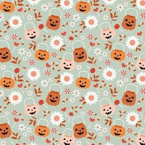 Smiley pumpkin buckets and sunflowers trick or treat fright night halloween kids design with candy corn and lollipops pink blush orange seventies vintage palette on sage green SMALL