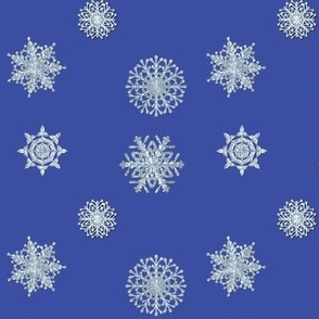 icy white snowflakes on dark blue