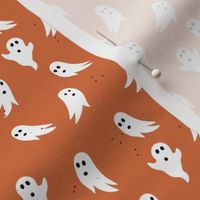 Spooky ghosts boho fright night minimalist halloween design on burnt orange 